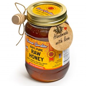 Raw honey in a 1-pound glass jar